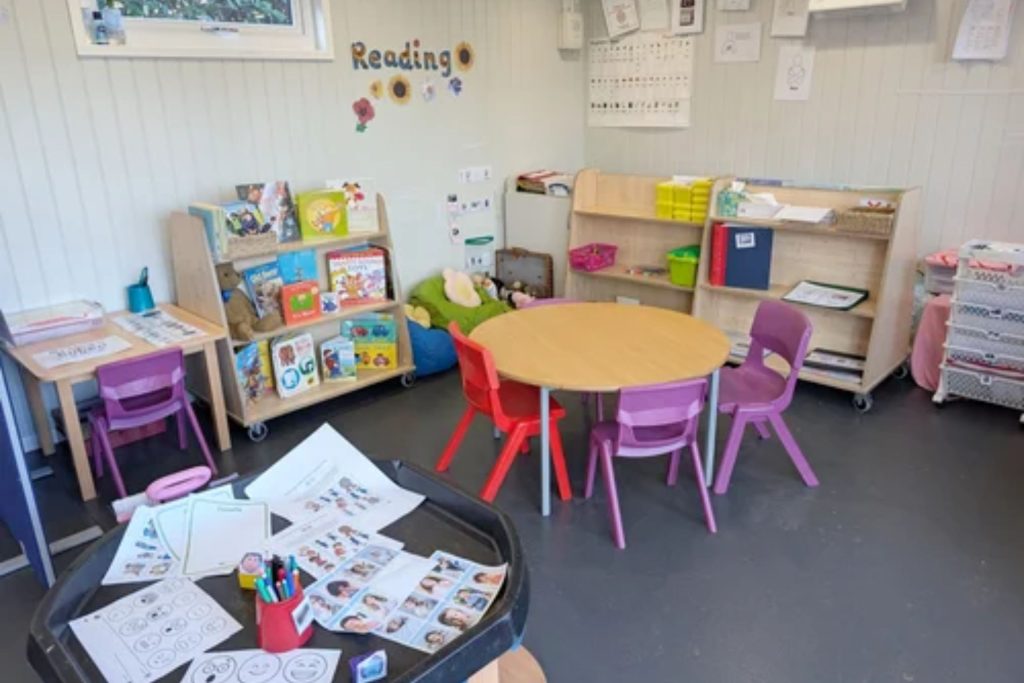 interior of outdoor classroom with table and chairs